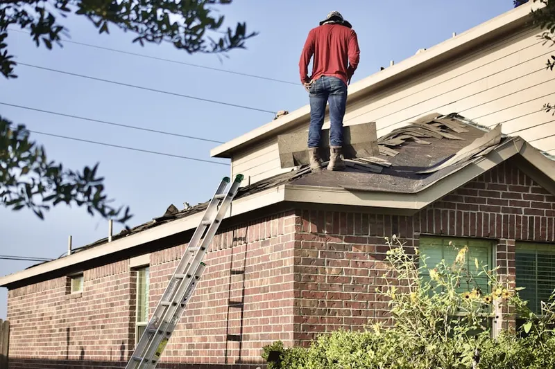 Professional roofer working on a residential roof in Ruraldale